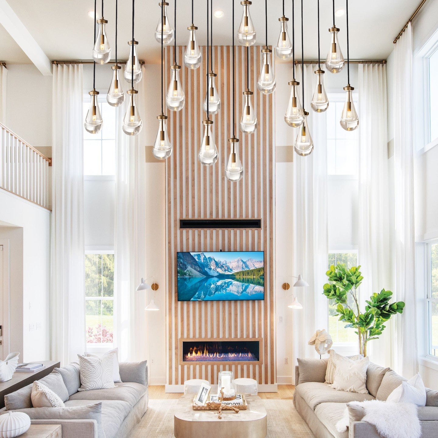 Modern living room with gray sofas, a coffee table, and decorative elements.